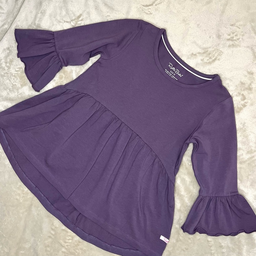 Purple ruffle tunic by Ruffle Butts.  Girls size 8.